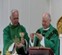 A group of men wearing green robesAI-generated content
            may be incorrect.