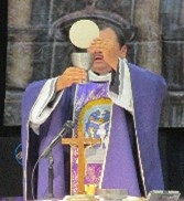 A person in a robe
            holding a chalice and covering his eyesAI-generated content
            may be incorrect.