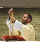 A person in a white robe holding a gold cupAI-generated
        content may be incorrect.