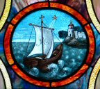 A stained glass
          window with a sailboat in the oceanAI-generated content may be
          incorrect.