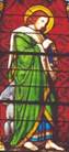 A stained glass
window with a green robeAI-generated content may be
incorrect.